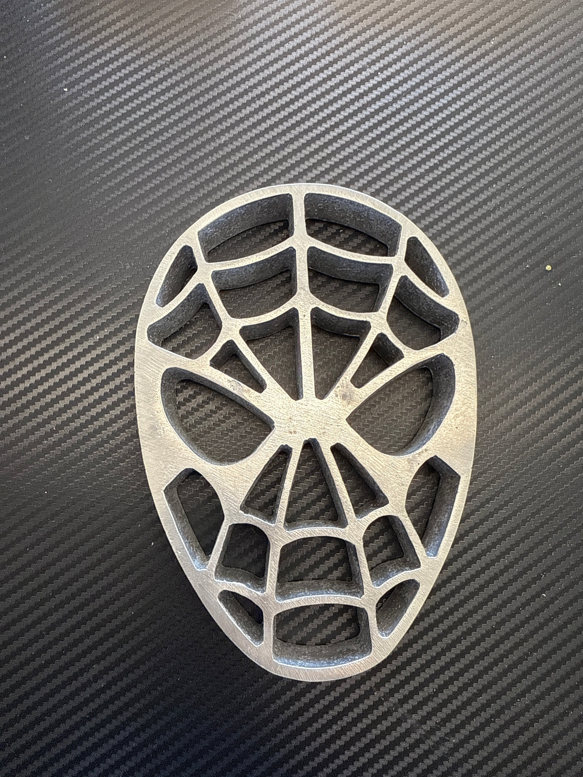 Aluminum Araña Man superhero spider mask mold for making traditional Mexican buñuelos de viento and crispy fried pastries.